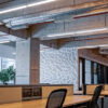 Empty modern office space with suspended LED linear lights