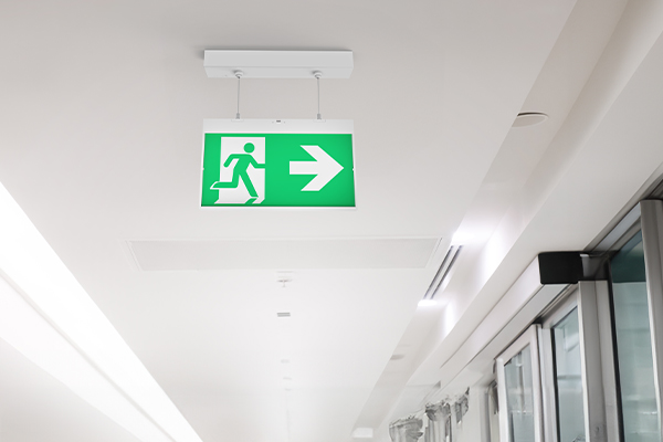 Hanging pendant emergency exit sign in hallway