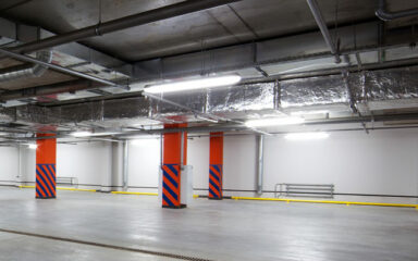 Batten lights illuminating an underground carpark