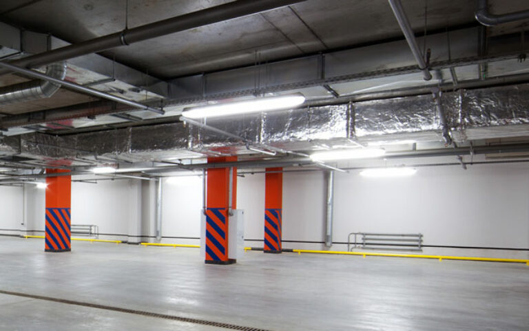 Batten lights illuminating an underground carpark